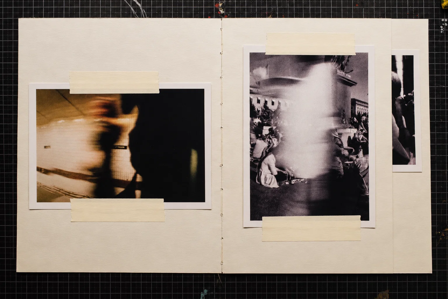 A warm-toned photograph of blurred figures in an interior passage on the left. On the right, a black-and-white crowd scene is interrupted by a bright vertical blur.