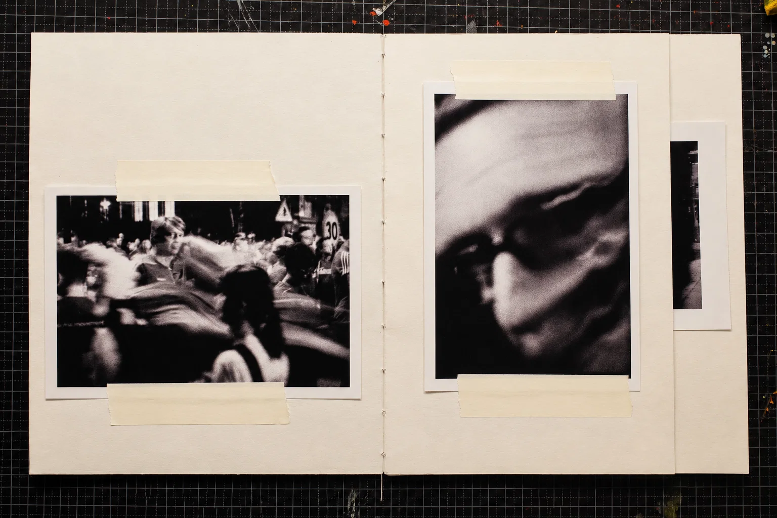 A crowded street scene with blurred movement and a more sharply defined figure on the left. On the right, an extreme close-up of a face, softened by motion blur and deep shadow.