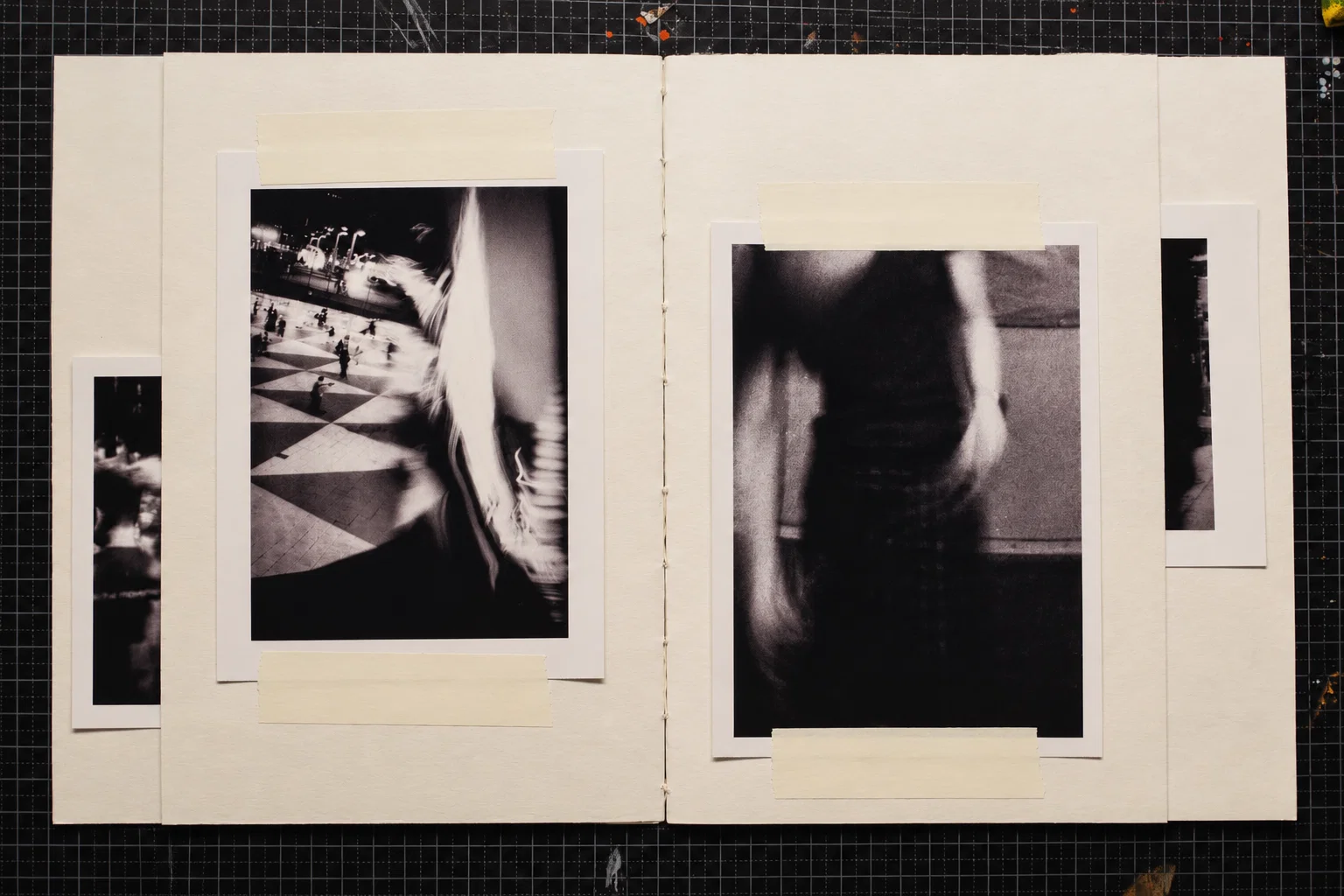 Two black-and-white photographs. On the left, a tiled public square with small figures is seen beside a large, blurred foreground figure. On the right, a dark, indistinct figure with a pale arm appears against a lighter background.