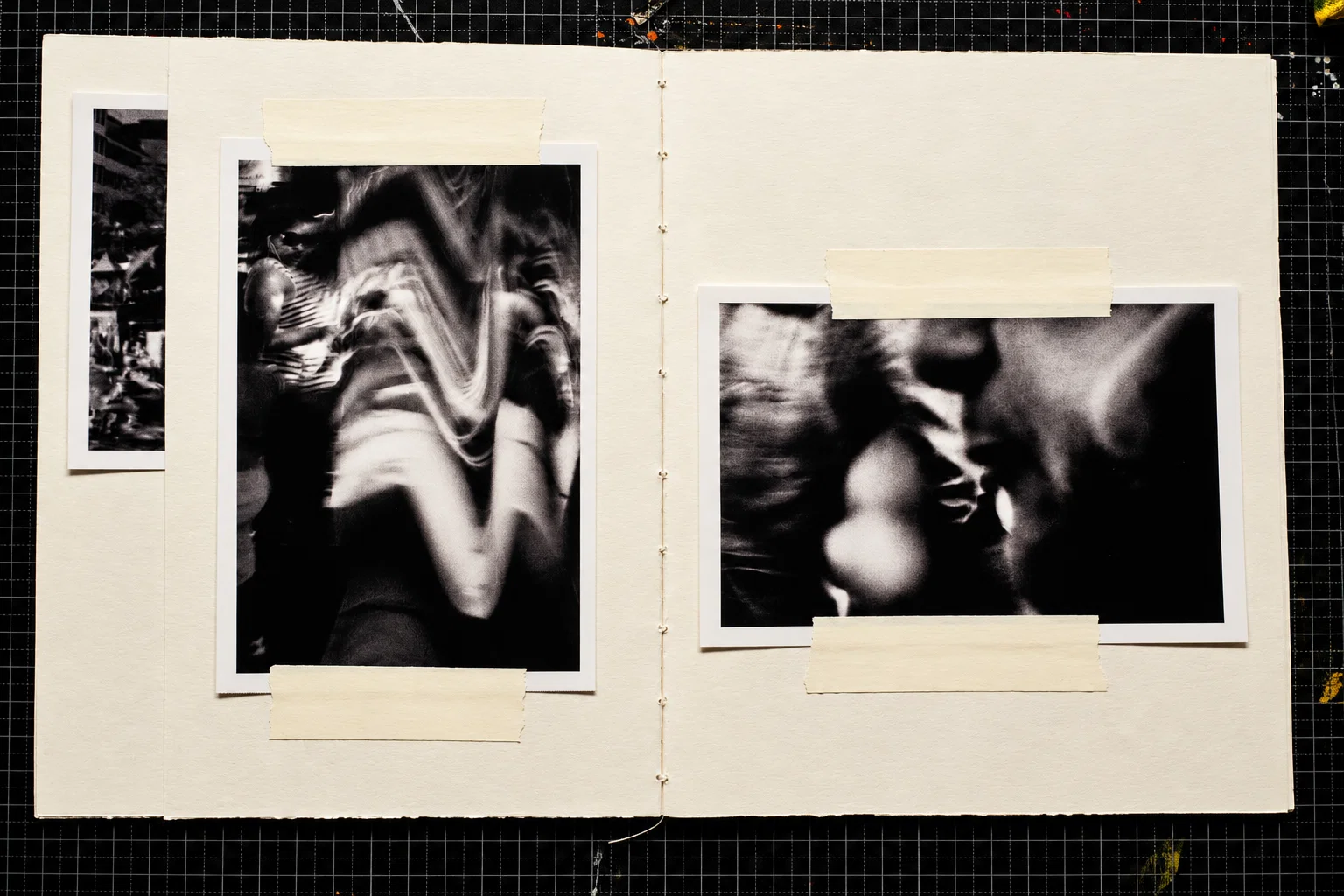 Two black-and-white photographs. On the left, closely overlapping figures and raised arms are blurred into sweeping, curved forms. On the right, an indistinct face and surrounding figures merge into dark and light shapes.